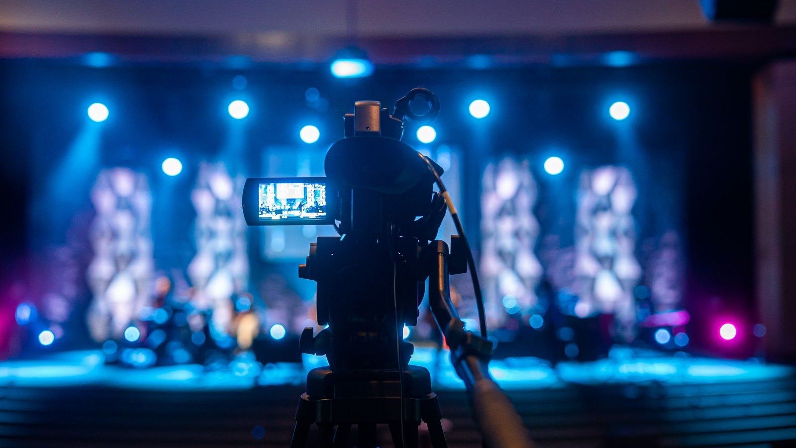 Professional video camera filming a concert LED stage, the shutter that actually sees refresh rate