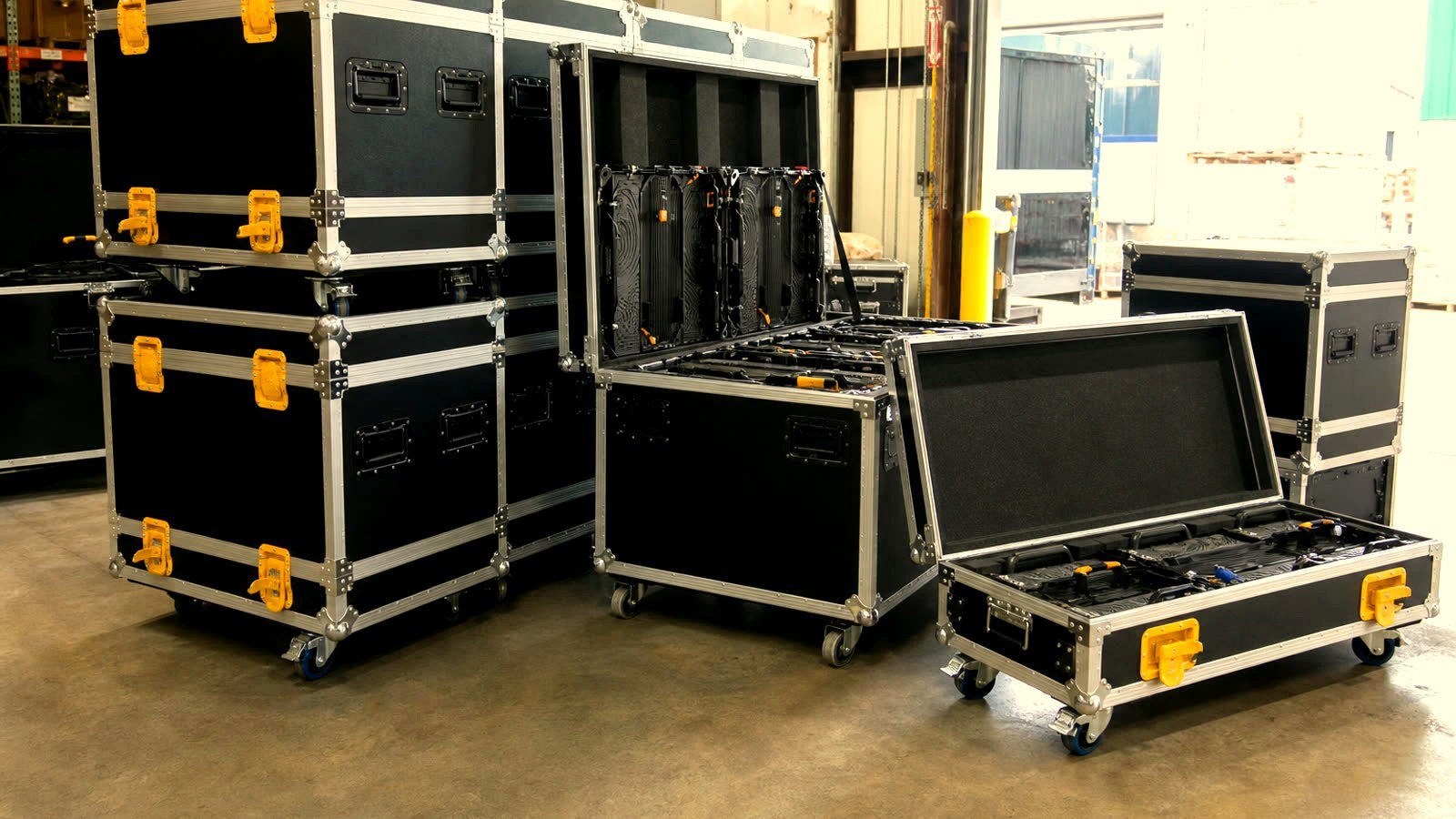 Flight cases packed with LED rental cabinets in foam, the touring inventory this pitch decision stocks