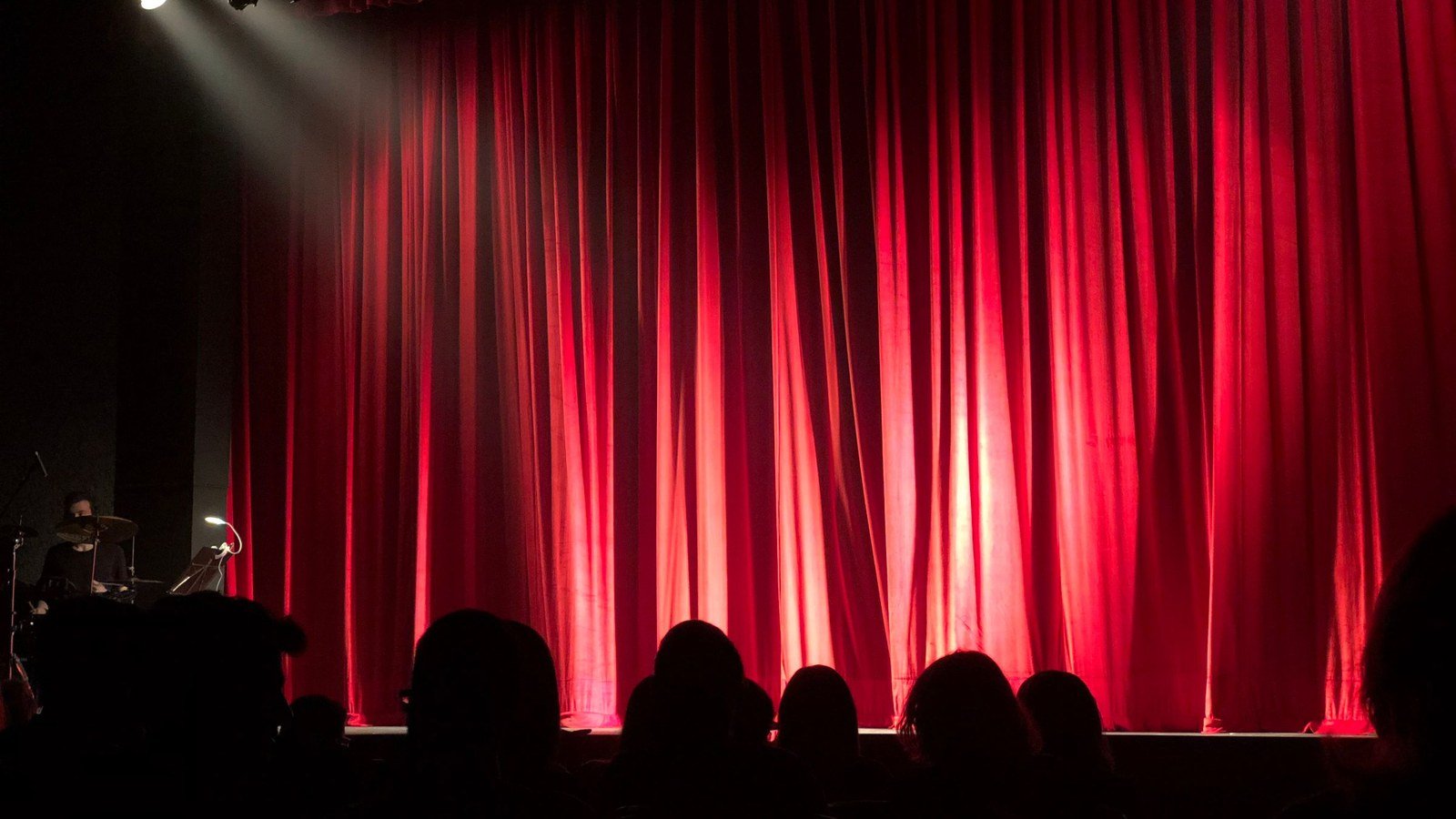 Front pews and aisle facing a stage — measure the closest seat before you pick pixel pitch