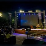 LED wall cabinets on a stage with truss and fly support